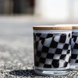 Two checkered flag printed candles