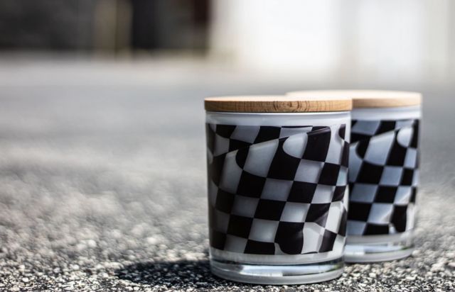 Two checkered flag printed candles