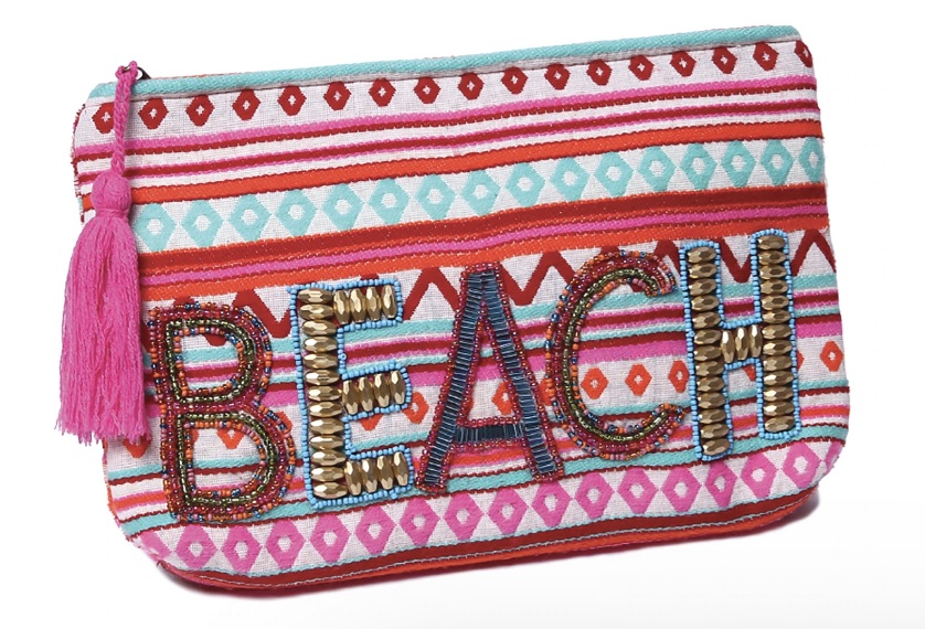 A clutch embroidered with the word beach