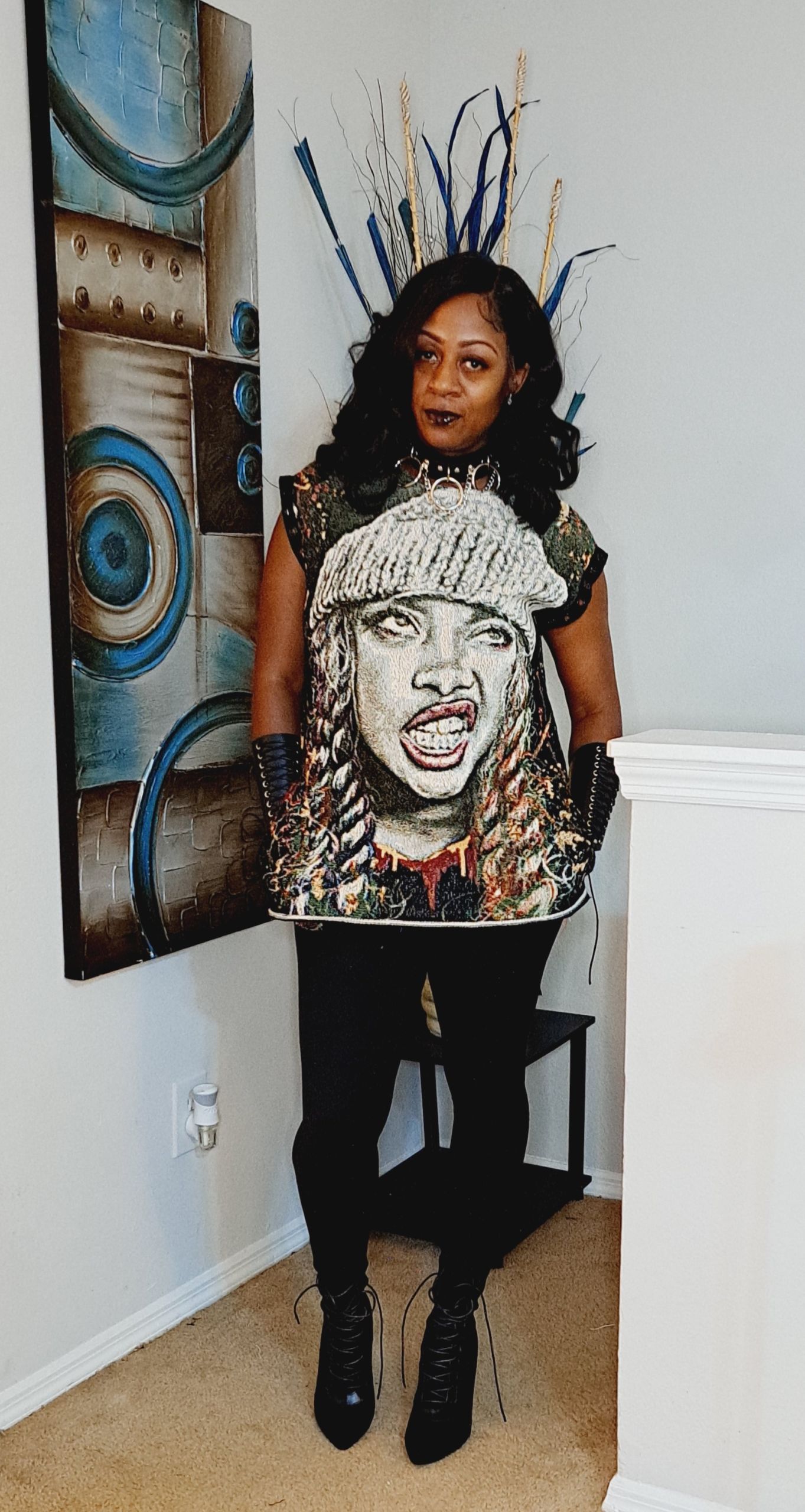 black woman wearing a t-shirt with artwork of a black woman on it