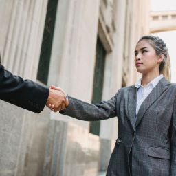 Woman shaking hands how to deal with difficult people