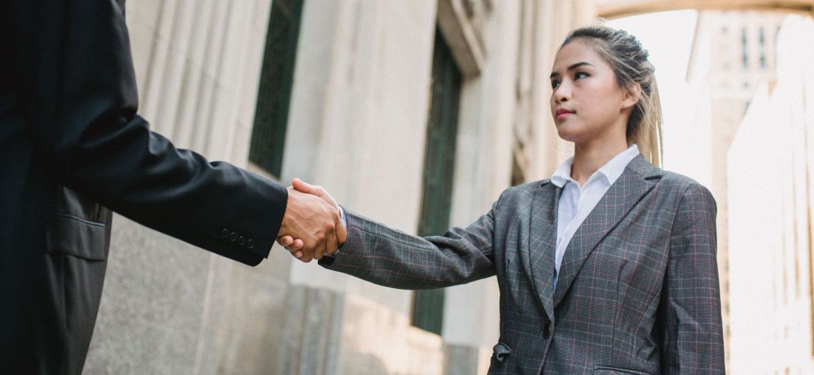 Woman shaking hands how to deal with difficult people