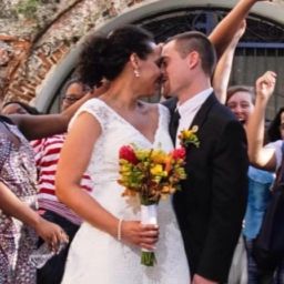 A man and woman kissing after getting married