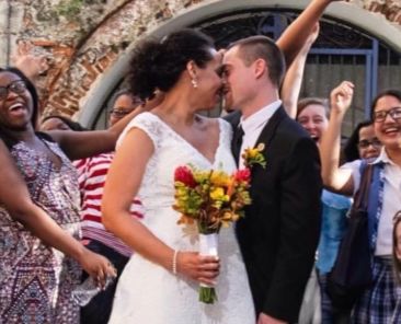 A man and woman kissing after getting married