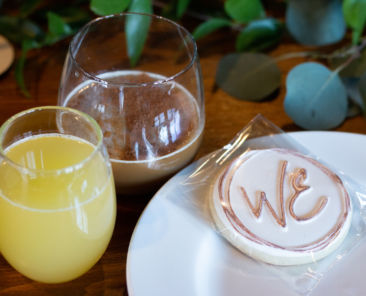 A cookie and drinks at a WE Brunch event