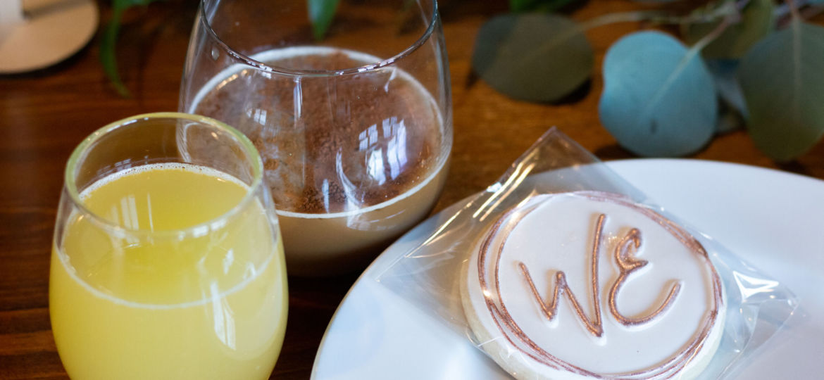 A cookie and drinks at a WE Brunch event