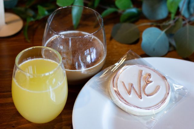 A cookie and drinks at a WE Brunch event