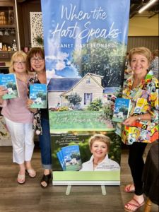 a photo of Cathy Shouse, Donna Cronk, and Janet Hart Leonard at Janet's Book Launch on June 5