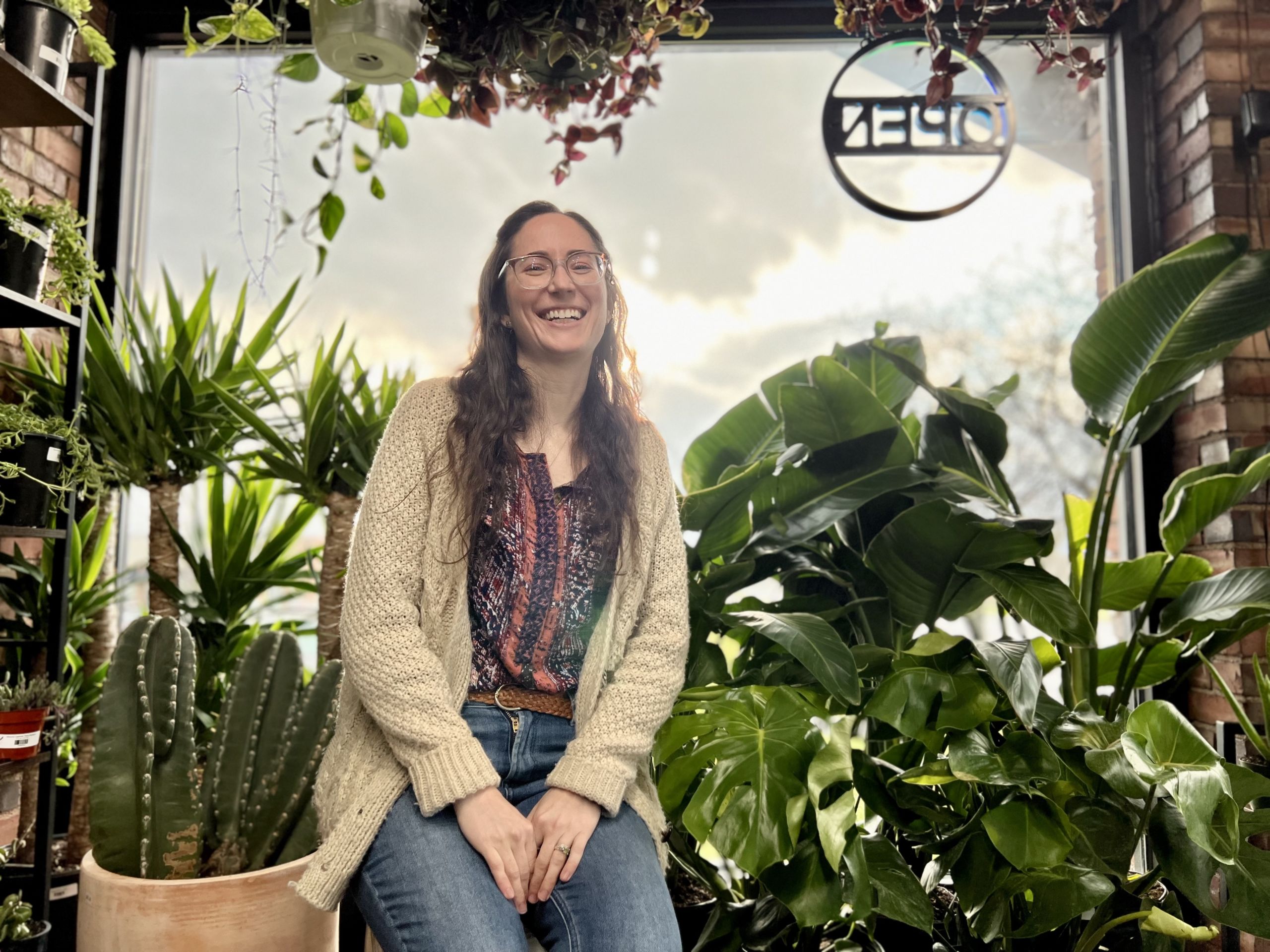 a photo of laura johns at her store, snakeroot botanicals plant store