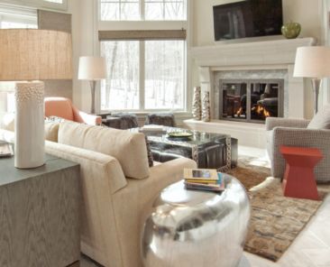 A living room with the fireplace going