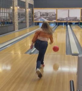 A photo of Emily Nelson bowling 