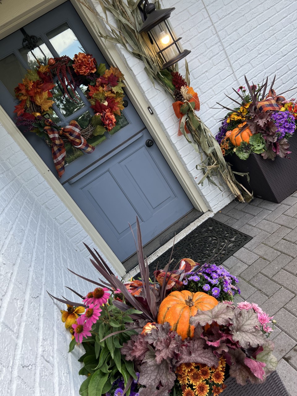 Fall containers on a front porch home design trend