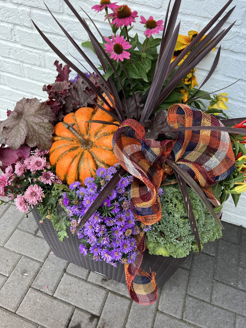 A fall container of flowers home design trend