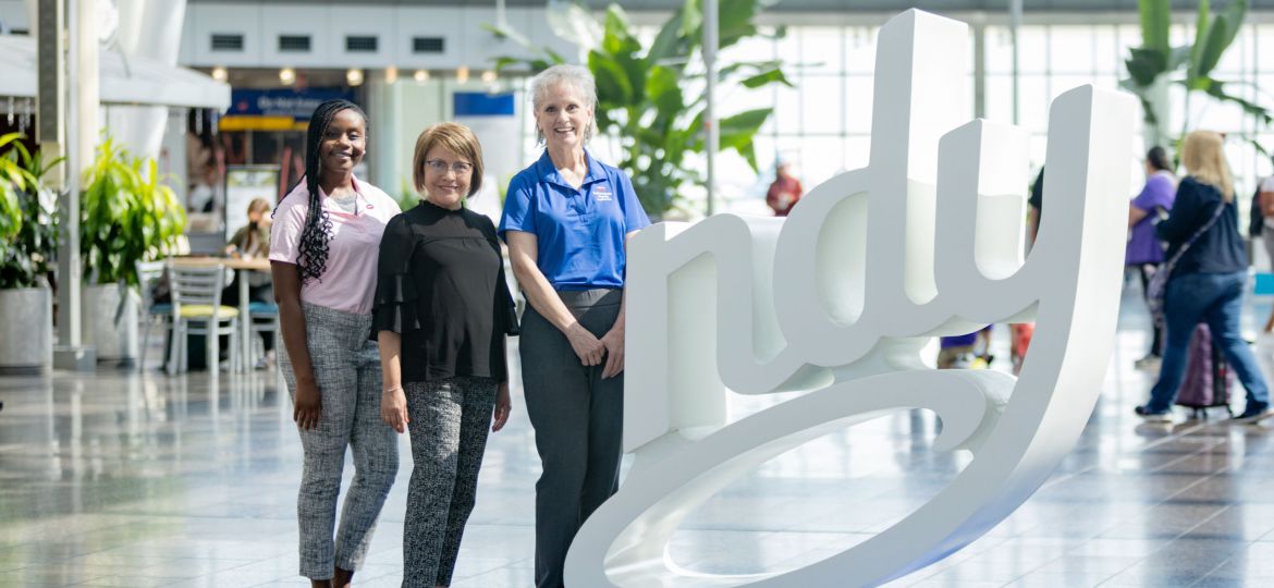 Three women at the Indianapolis International Airport