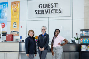 Three women at the guest services desk of the Indianapolis International Airport