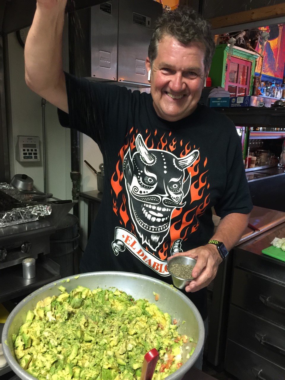 A man making guacamole