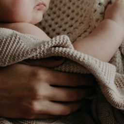 Parent holding infant
