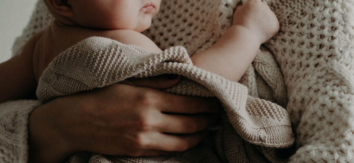 Parent holding infant