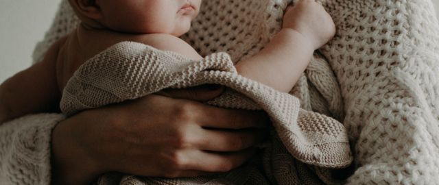Parent holding infant