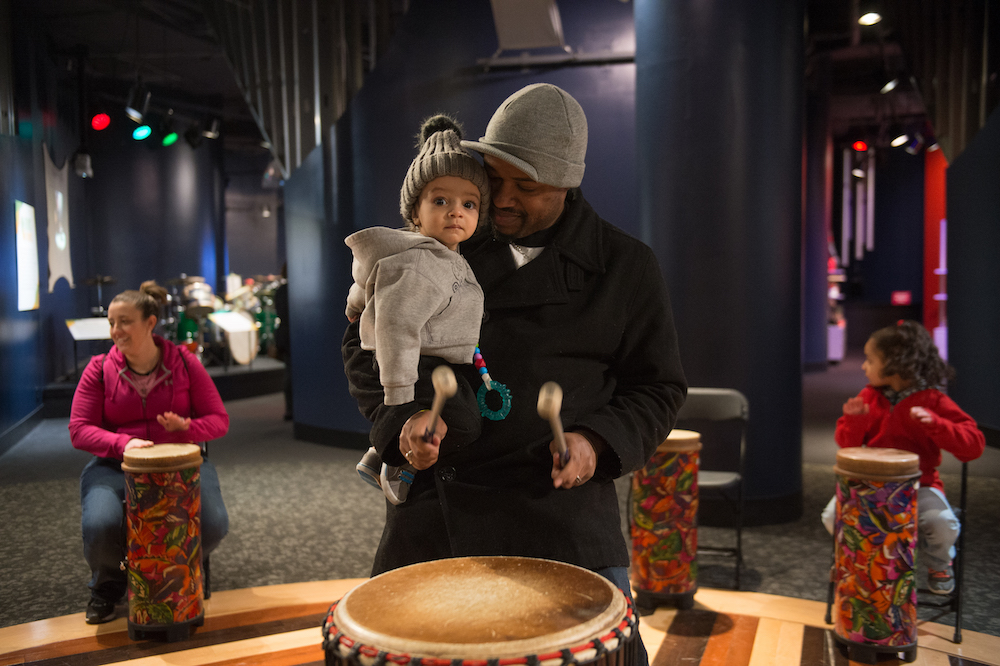 A family visiting the Rhythm! Discovery Center
