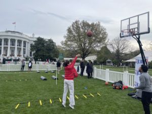 Allison Barber shooting hoops on the White House lawn