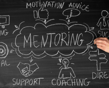 Chalkboard with "Mentoring" written on it