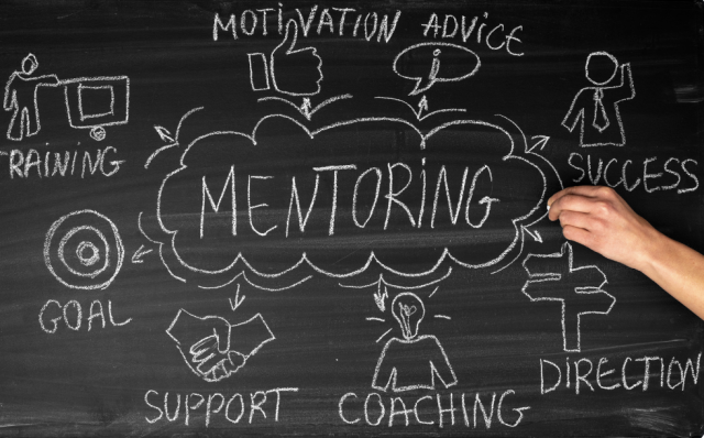 Chalkboard with "Mentoring" written on it