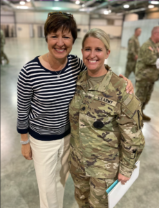 Allison Barber with a member of the armed forces