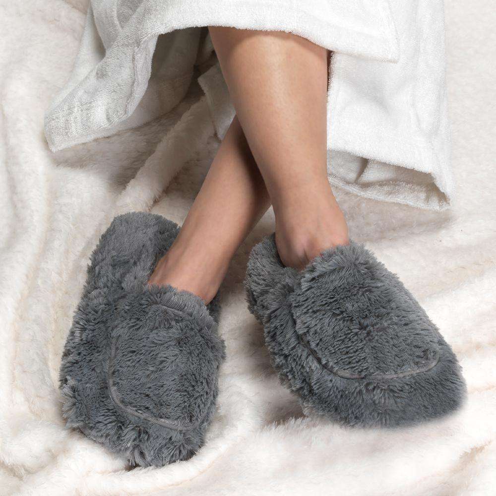 A woman wearing cozy slippers
