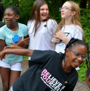 Girl Scouts laugh and play in a get-to-know-you activity at Camp Dellwood in Indianapolis during a fall recruitment day.