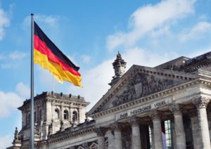 German flag flying in front of building in Berlin