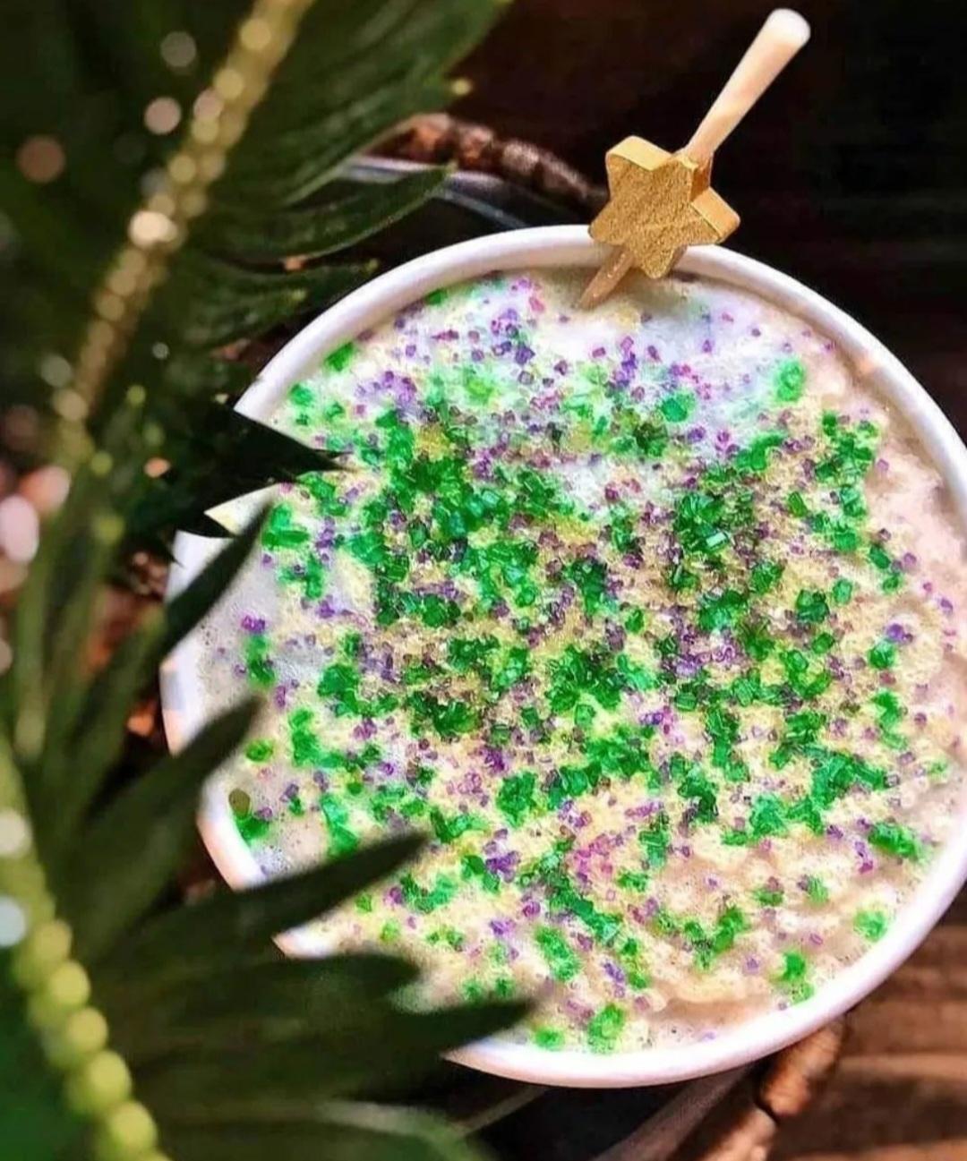 GoldLeaf specialty latte topped with green and purple sprinkles.