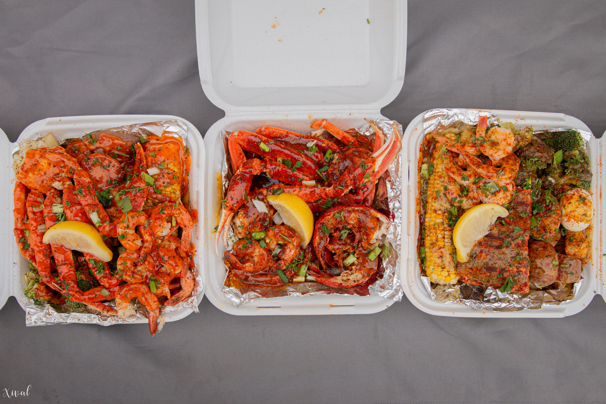 Loaded crab legs & shrimp tray, classic leg, tail & shrimp tray, and loaded salmon & shrimp tray