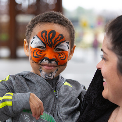 Child with face paint on on the Indianapolis Zoo