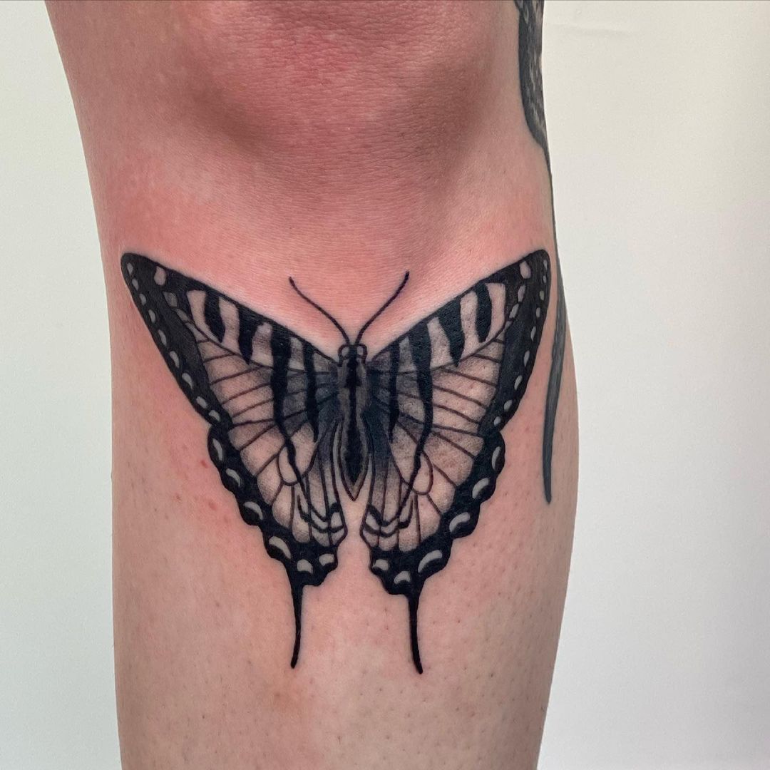 Butterfly knee tattoo by Megan Zoeller