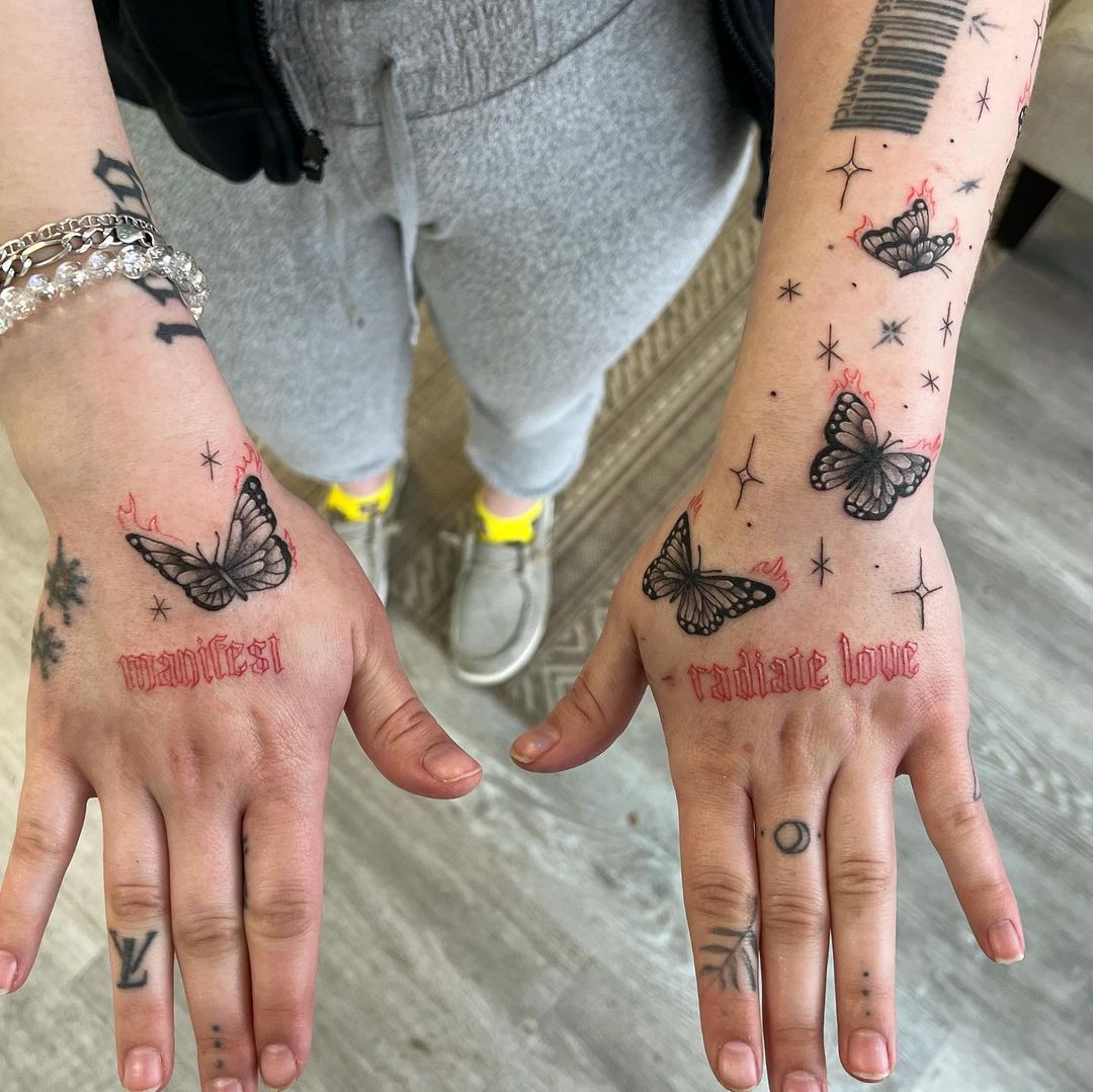 Butterfly and star hand tattoos by Saya Johnson