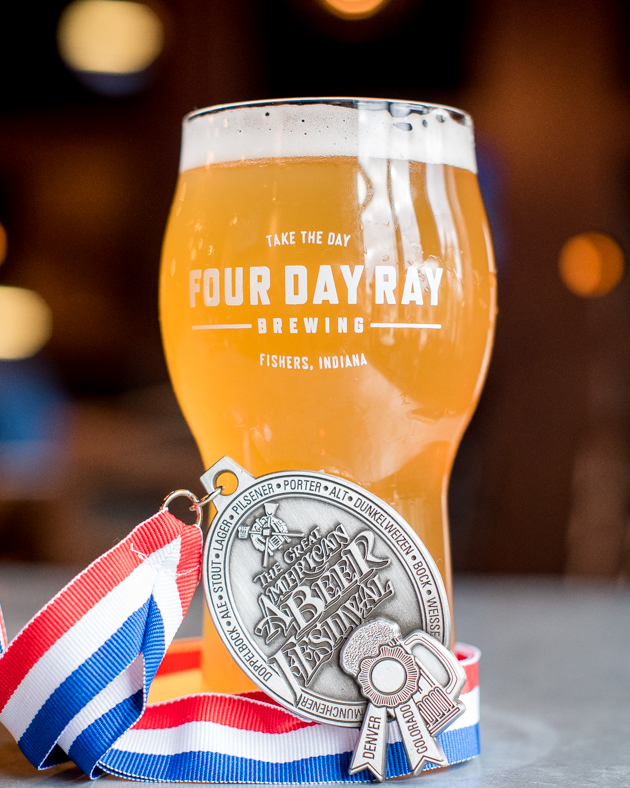 Four Day Ray Brewing draft beer with a medal from "The Great American Beer Festival
