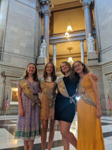 Sophie Holladay (purple dress), Katie Bergman, Grace Link (black dress), Makenna Kenworthy (yellow dress) at the Statehouse July 2022