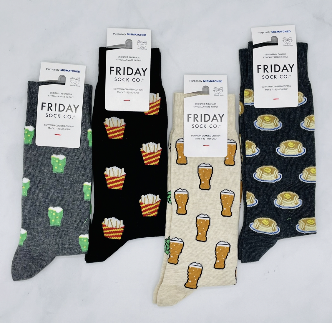 Four pairs of socks, including waffles and french fries