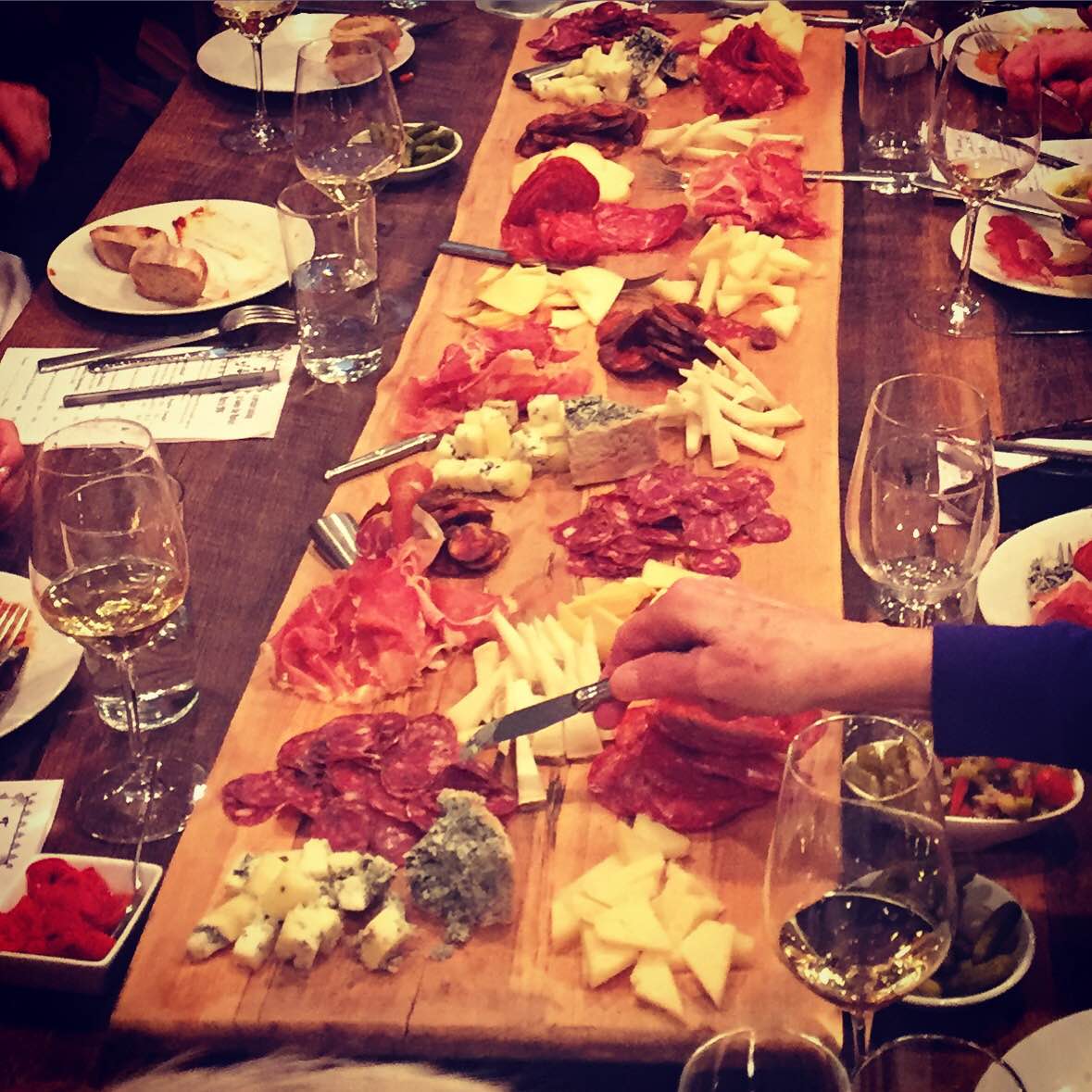 Table with a charcuterie board photo provided by Goose the Market