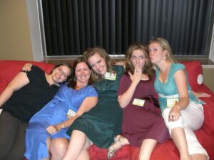 five female bloggers posing on a couch