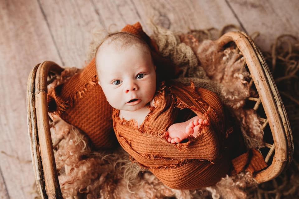 Newborn portrait shot by Dellarose Photography