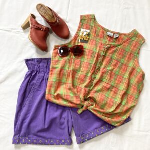Orange and green tank top and purple shorts