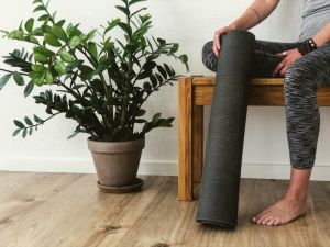 Yoga Mat and woman sitting on a bench