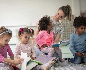 Woman reading to kids.