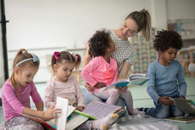 Woman reading to kids.