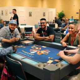 A group of people playing a game together at Gen Con.