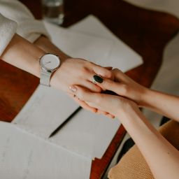 Two people holding hands.