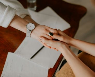 Two people holding hands.