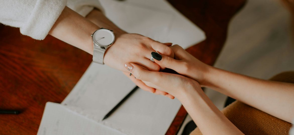 Two people holding hands.